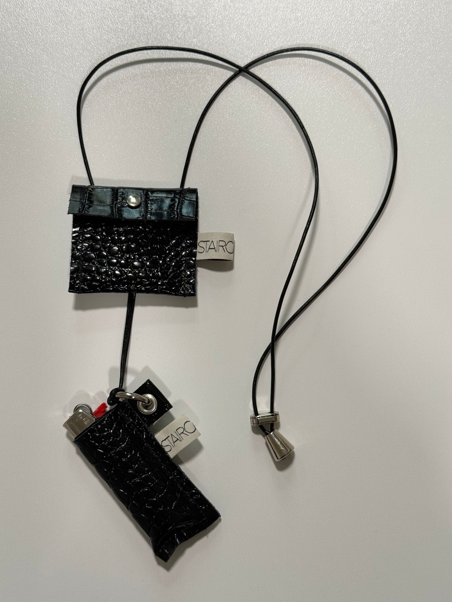 "HIDDEN FLAME" (sling on) with "LIGHTER BAG"