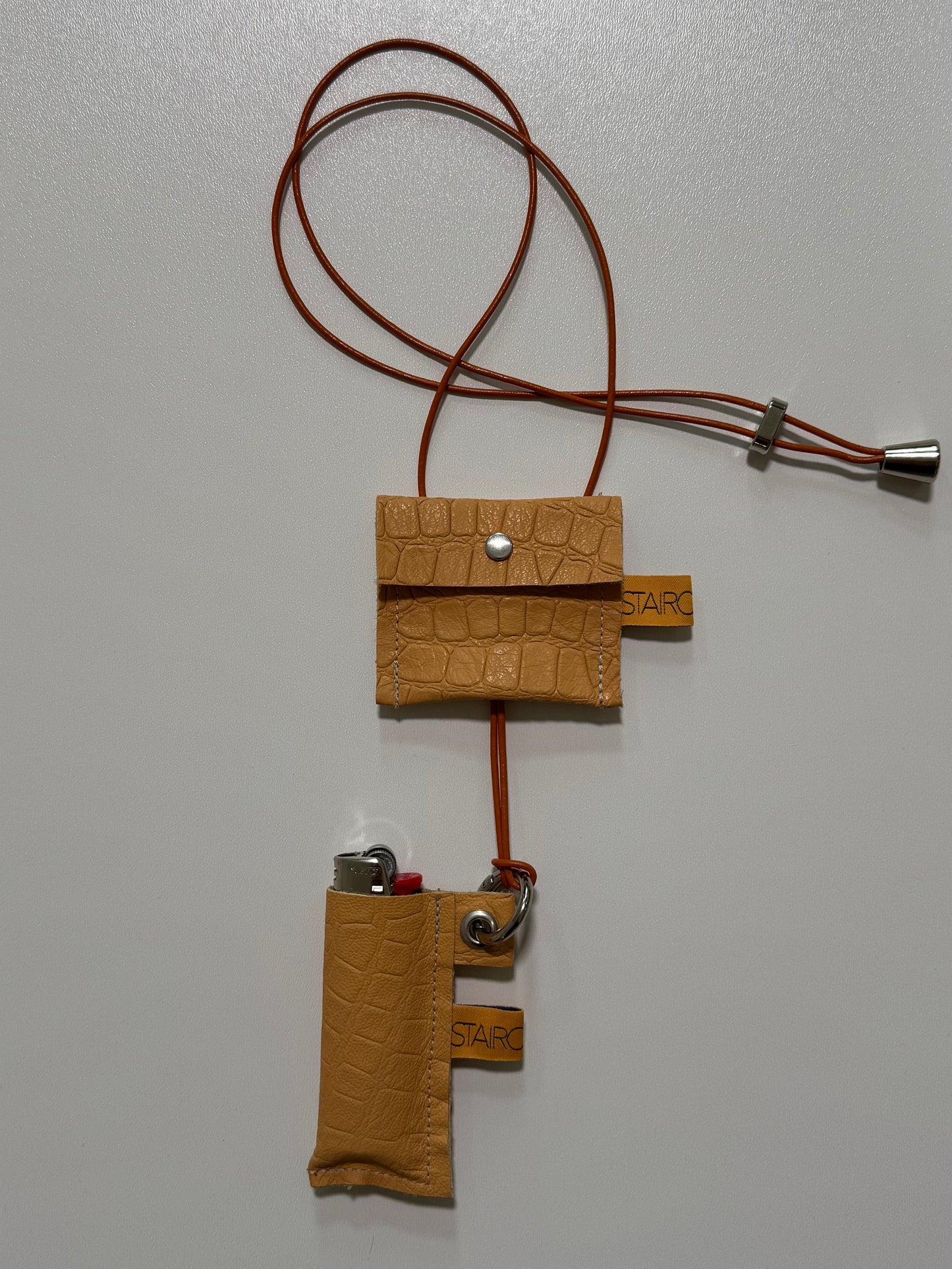 "HIDDEN FLAME" (sling on) with "LIGHTER BAG"